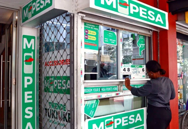 M-Pesa agent outlet in Kenya where customers withdraw and deposit cash at the counter
